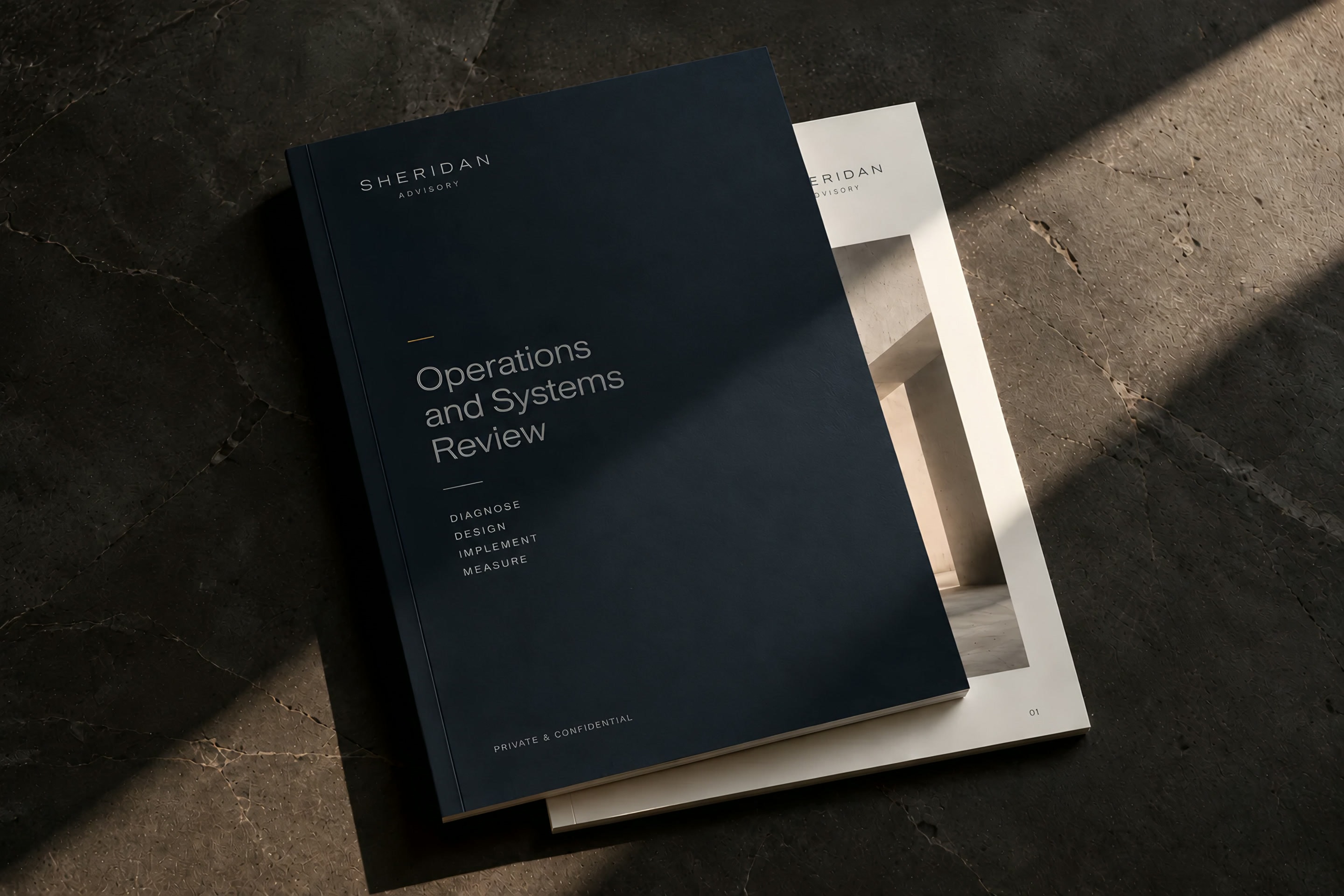 A navy Sheridan Advisory Operations and Systems Review report on dark stone in raking light