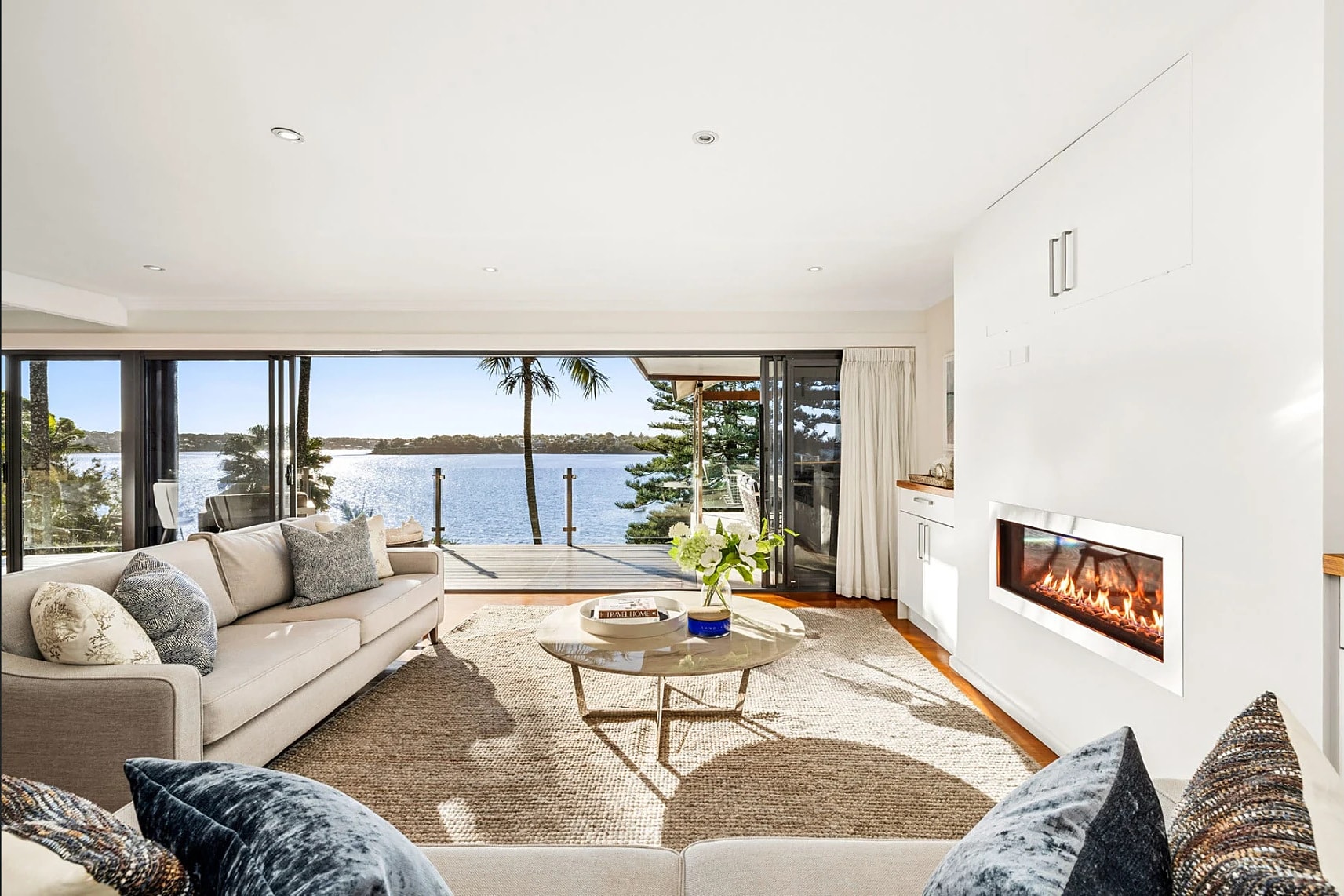 Lounge with a fireplace and water views