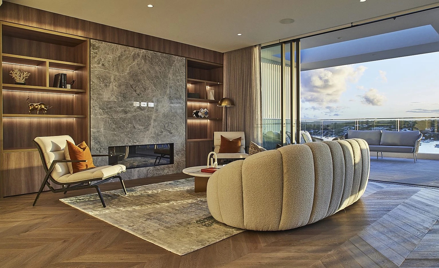 Lounge with a marble fireplace and water views