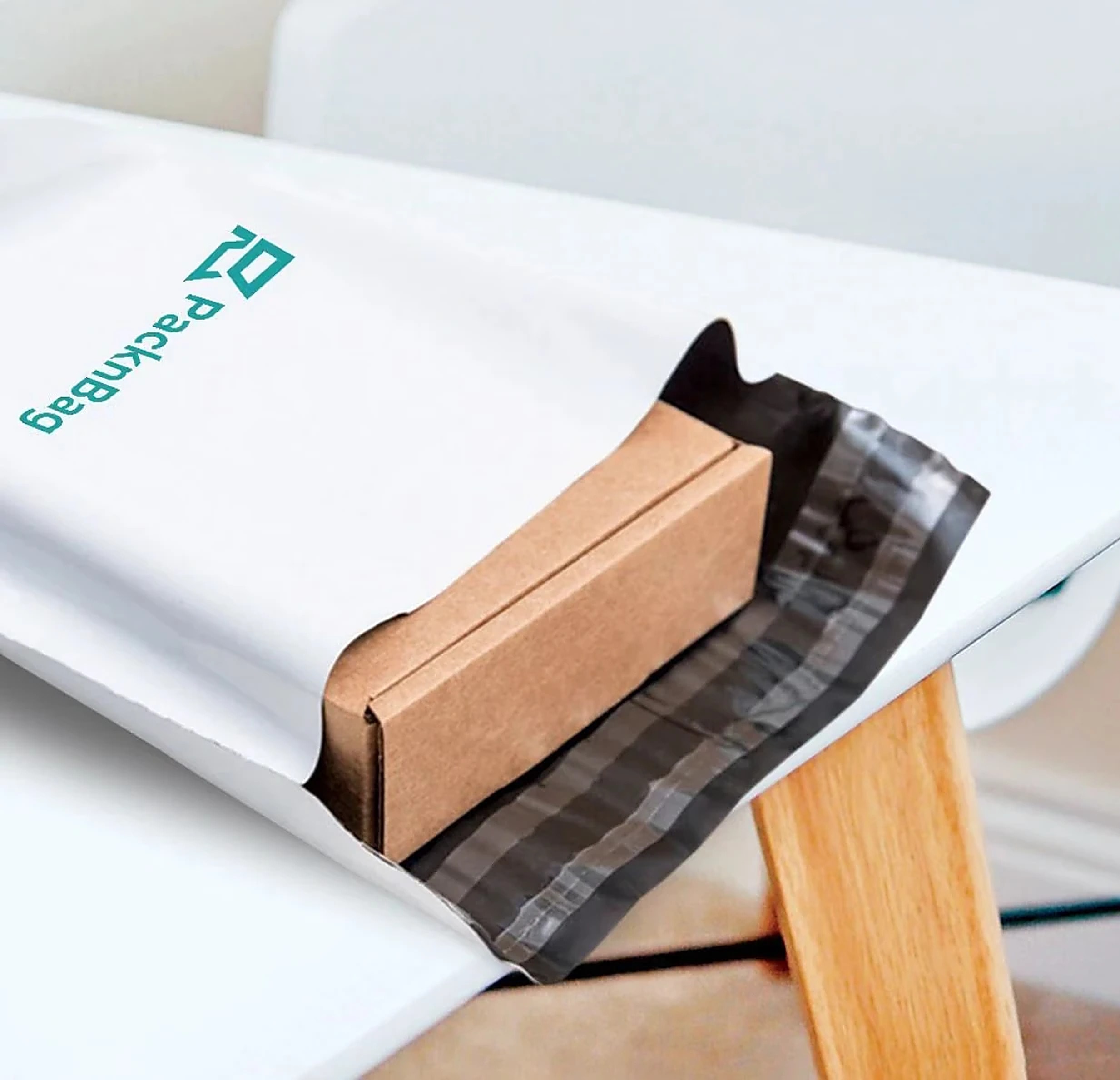 A boxed order sliding into a PackNBag satchel