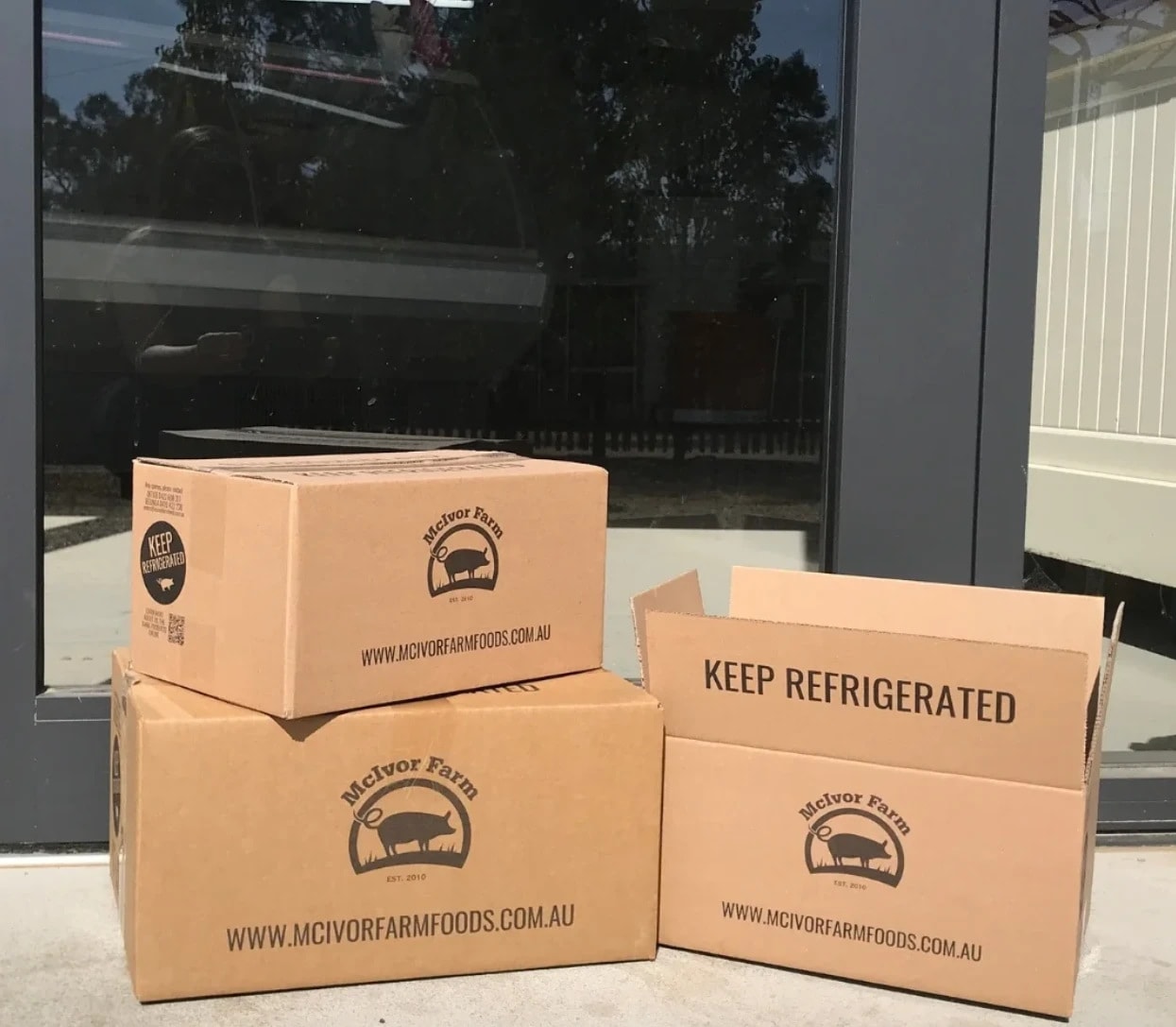 Branded kraft boxes for a farm delivered to a doorstep