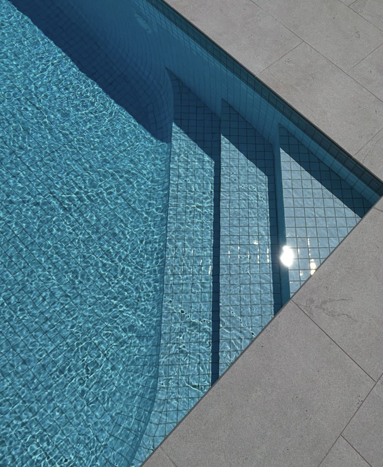 Tiled pool steps under water